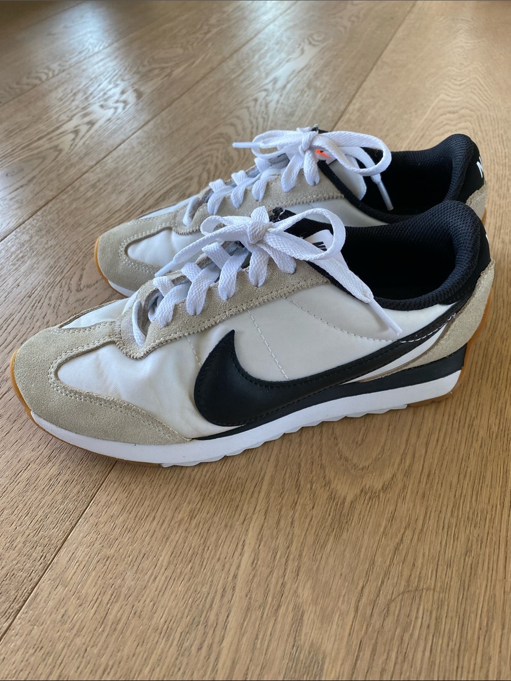 Nike Women’s Retro Runner Sneakers in White, Black and Beige